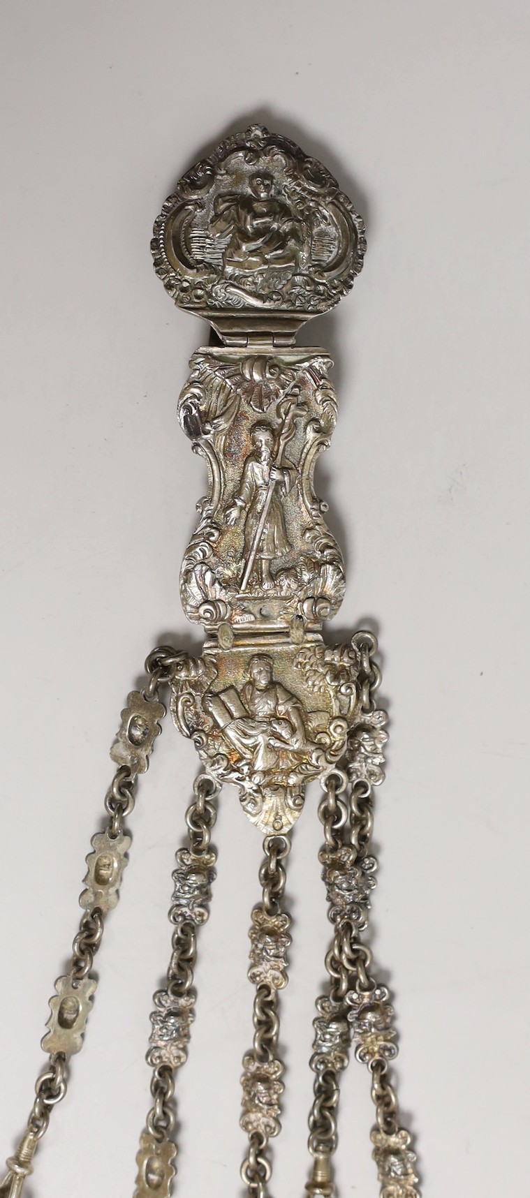 A Victorian white metal chatelaine with five accessories, import maker's mark for B.H. Joseph & Co, 32.7cm.
